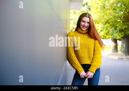 Portrait Of Happy Young Redhead Woman Smiling Stock Photo