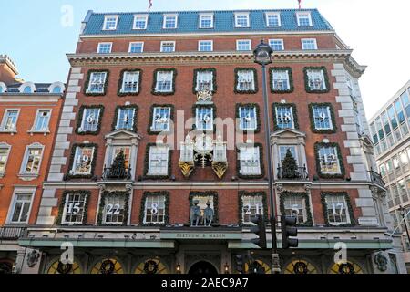 Fortnum & Mason Christmas store exterior view of advent calendar theme decorations on windows facade in Piccadilly 2019 London England UK KATHY DEWITT Stock Photo