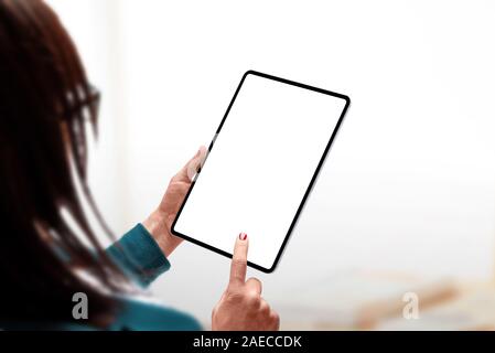 Tablet mockup. Woman holding tablet in hand and touch isolated screen concept. Modern tablet wih thin edges Stock Photo