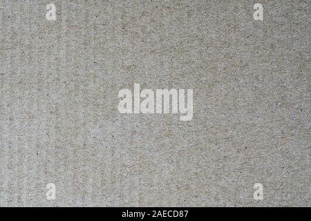 Light brown texture from sheet of recycled cardboard. Close up detail view of abstract recycled eco-friendly material pattern background Stock Photo