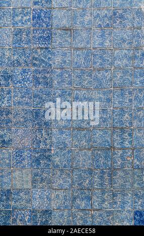 Close-up of wall of blue and aged ceramic tiles. High resolution full frame textured background. Stock Photo