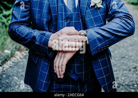 Hands of wedding groom getting ready in suit Stock Photo