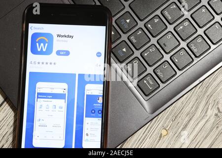 Los Angeles, California, USA - 3 December 2019: Workday App Logo on phone screen with laptop flat lay, Illustrative Editorial. Stock Photo