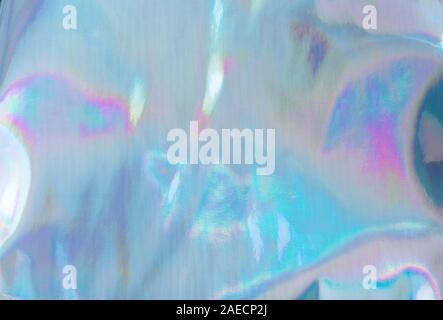 Holographic Foil Texture. Abstract soft pastel iridescent background. Rainbow color sunlight spots and gradient. Stock Photo