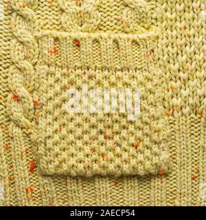 Knitted Pocket on a Knitted Sweater. Knitted Sweater Texture Close-Up View Stock Photo