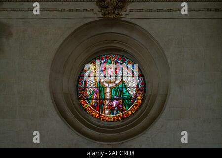 Stained glass window in 'Our Lady of the Assumption' Cathedral in Granada. Andalusia, Spain, June-03-2019 Stock Photo