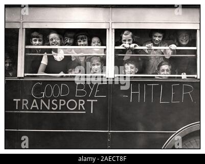 EVACUATION YOUNG EVACUEES WW2 'Goodbye Hitler'  London- East End children evacuating at the start of the WW2 Second World War 1940's image of smiling British children being evacuated on a London Transport Bus away from Nazi Germany Blitz bombing, as part of Operation Pied Piper. Ultimately 3.5 million people were relocated as part of the World War II evacuation. Second World War Stock Photo