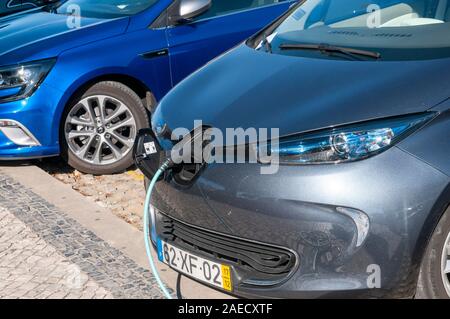 Electric car at a charging station photographed in Aveiro, Portugal Stock Photo