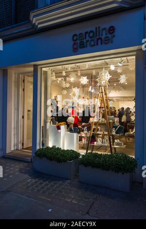 Shoppers browsing in the Caroline Gardner designer gift shop in Marylebone High Street, London, UK Stock Photo