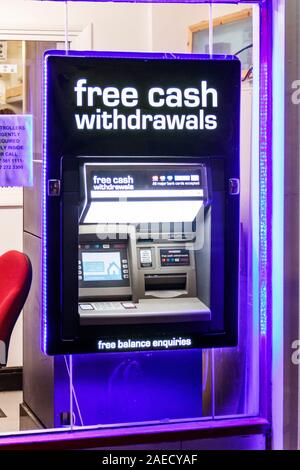 A cash withdrawal machine (ATM) set in the window of a shop in Archway, North London, UK Stock Photo