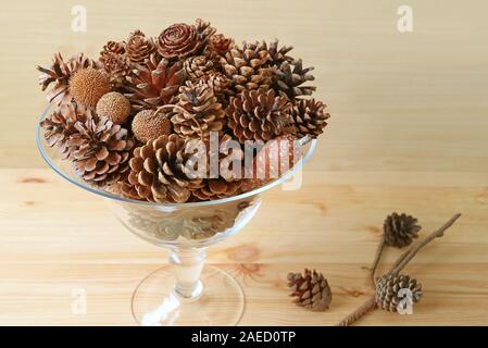 Christmas Decoration with Various Types of Dry Pine Cones in a Glass Compote Stock Photo