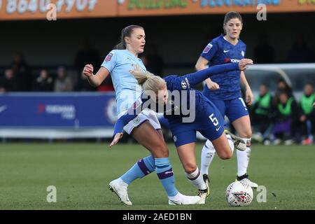 Kingston, UK. 17th Nov, 2019. Hannah Blundell of Chelsea Ladies being tripped by Caroline Weir of Manchester City Women during the Barclays FA Women's Super League match between Chelsea and Manchester City at the Cherry Red Records Stadium, Kingston on Sunday 8th December 2019. (Credit: Jacques Feeney | MI News) Photograph may only be used for newspaper and/or magazine editorial purposes, license required for commercial use Credit: MI News & Sport /Alamy Live News Stock Photo