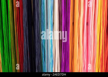 Many multi-coloured laces or cords sold on the local market Stock Photo