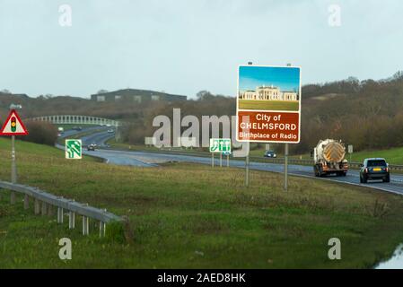 Vehicles approaching Chelmsford, Essex, UK driving on a stretch of A130 duel carriageway near Battlesbridge. Sign with birthplace of radio slogan Stock Photo