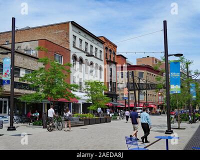 ITHACA, NY - MAY 2019:  Ithaca, the home of Cornell University, has a lively downtown with shopping and restaurants, including this pedestrianized str Stock Photo