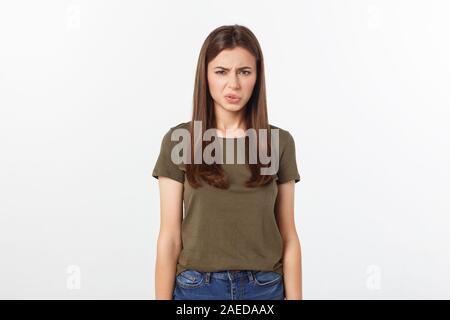 Close-up portrait of a young attractive woman who covers her nose, something stinks, isolated on white background Stock Photo