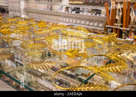 Golden olive branch crowns. Greek wreath or chaplet sold on local market in Athens Stock Photo
