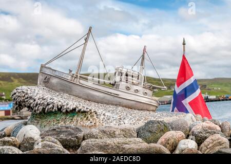 The Shetland Bus memorial in Scalloway, Shetland, with a Norwegian flag. Stock Photo