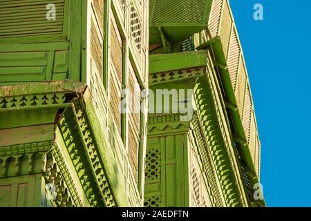 Close-up view of the greenish Noorwali coral town house at the Souk al Alawi Street in the historic city center of Al Balad, Jeddah, Saudi Arabia Stock Photo