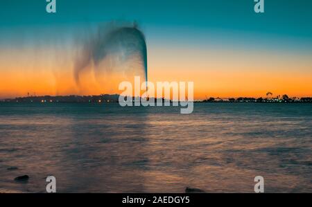 Panoramic view of the King Fahd's Fountain seen from the South Corniche, Jeddah, Saudi Arabia, with a beautiful sunset in the background Stock Photo