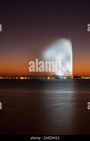 View of the King Fahd's Fountain seen from the South Corniche, Jeddah, Saudi Arabia, with a beautiful sunset in the background Stock Photo