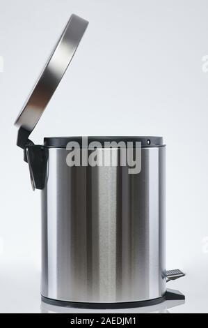 Open steel trash bin side view isolated on white background Stock Photo