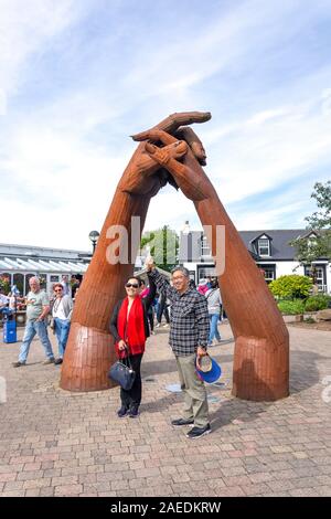 Couple by hand holding sculpture, Gretna Green Famous Blacksmiths Shop, Gretna Green, Gretna, Dumfries and Galloway, Scotland, United Kingdom Stock Photo