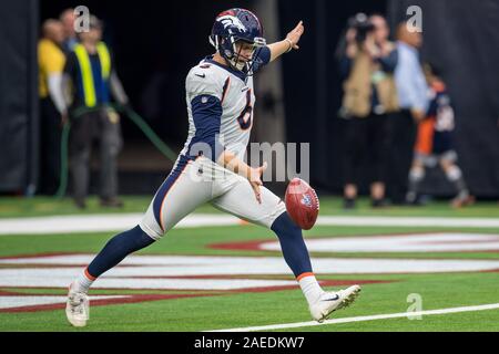 October 27, 2019: Denver Broncos kicker Brandon McManus (8) kicks field  goal out of the hold by Denver Broncos punter Colby Wadman (6) during NFL  football game action between the Denver Broncos