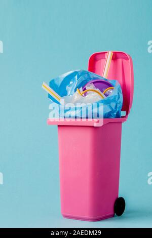 Studio shot of a pink big trash on blue background Stock Photo