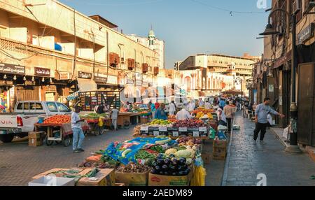 View of people at the Souk Baab Makkah street market at the historic district Al Balad in Jeddah, KSA, Saudi Arabia Stock Photo