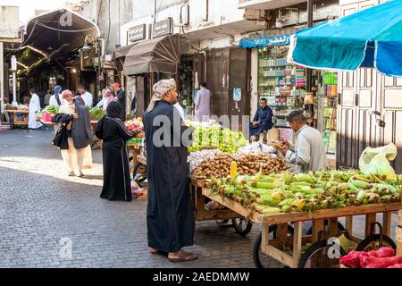 View of people at the Souk Baab Makkah street market at the historic district Al Balad in Jeddah, KSA, Saudi Arabia Stock Photo