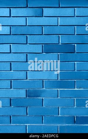 Blue background from brick wall texture pattern, wallpaper design template. Classic Blue Color is color the Year 2020. Stock Photo