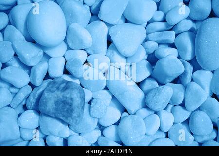 Classic blue color of the year 2020. Stone background is painted in a modern color trend. Stock Photo