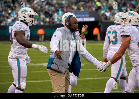 East Rutherford, New Jersey, USA. 8th Dec, 2019. Miami Dolphins head coach Brian Flores celebrate with players after a play during a NFL game between the Miami Dolphins and the New York Jets at MetLife Stadium in East Rutherford, New Jersey. Jets defeated the Dolphins 22-21. Duncan Williams/CSM/Alamy Live News Stock Photo