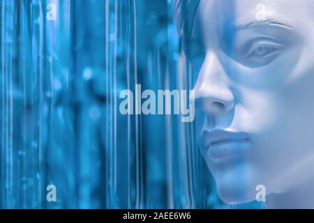 stylish beauty female mannequin head on a blurred colored calm blue background, light tinting. blank layout for fashion and beauty advertising. close- Stock Photo