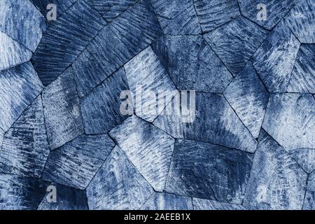 Blue tiled stone wall background, pattern with different geometric shapes. Stock Photo