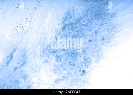Trend abstraction of blue acrylic paint on a white background Stock Photo