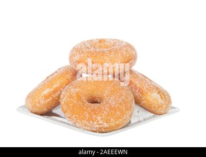 Square plate with sugar coated  donuts stacked, isolated on white Stock Photo