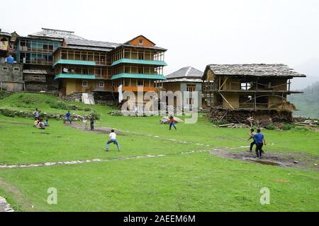 Children playing cricket, Sarchi Village, Tirthan Valley, Himachal Pradesh, India, Asia Stock Photo