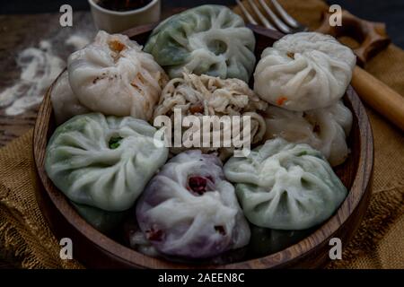 Close-up of Chinese chives Dumplings Mixed Color or Garlic Chives Dim Sum Rice Cake inside with Taro Slice ,Bamboo shoot and Many kind of vegetable in Stock Photo