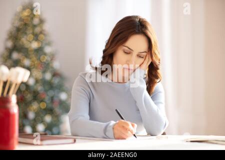 Young cute woman in grey homewesar looking upset and lonely Stock Photo