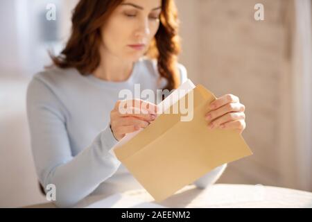 Pretty young woman with long hair looking worried Stock Photo