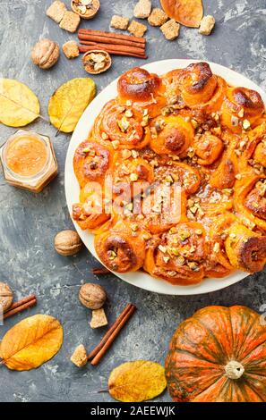 Pumpkin buns with nuts and brown sugar.Cinnamon rolls or cinnabon Stock Photo