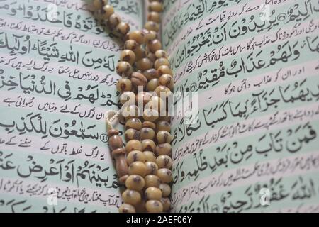 Tasbih on Quran shareef  holy book Stock Photo