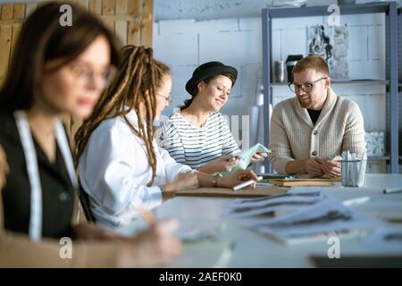 Group of creative young designers or students working over new project Stock Photo