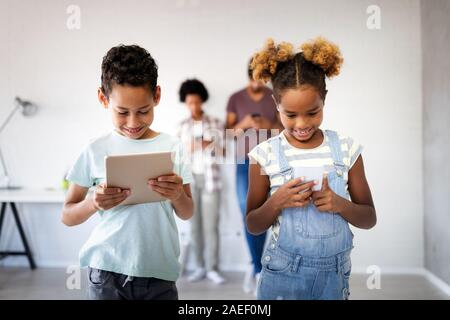 Family sharing there privacy data by using digital devices, phones, tablets Stock Photo