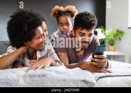 Happy family spending time together and having fun at home. Stock Photo