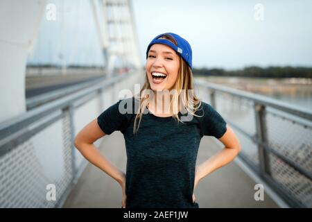 Portrait of woman taking break from running Stock Photo