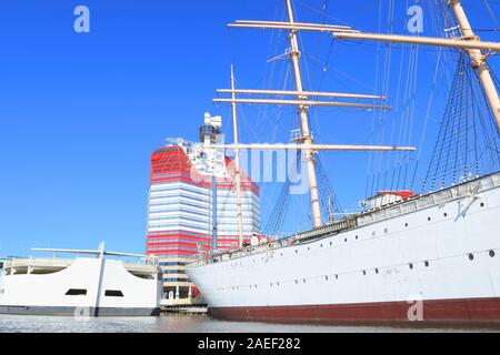 Barken Viking (a barque hotel ship) lies docked in front of The Lipstick (designed by Ralph Erskine) in Lilla Bommen district in Gothenburg, Sweden Stock Photo