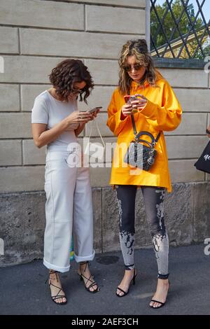 MILAN, ITALY - SEPTEMBER 20, 2019: Woman with brown Louis Vuitton checkered  bag, white dress and Dior bracelets before Sportmax fashion show, Milan Fa  Stock Photo - Alamy